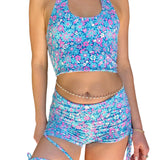 Person wearing a blue floral two-piece swimsuit indoors.